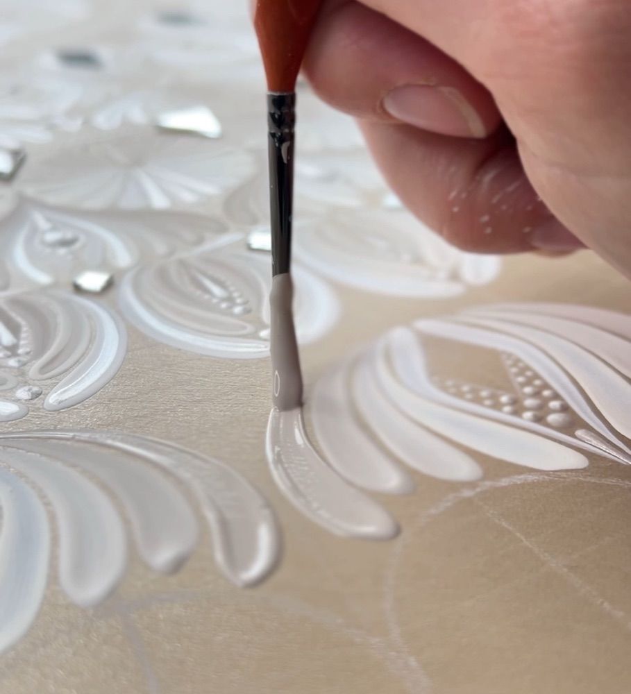 Close-up of a white brushstroke being painted